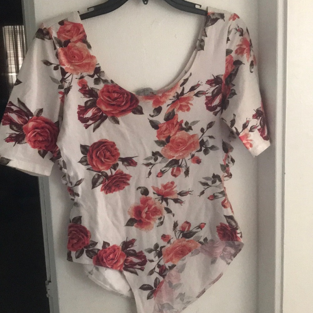 A white with flowers bodysuit